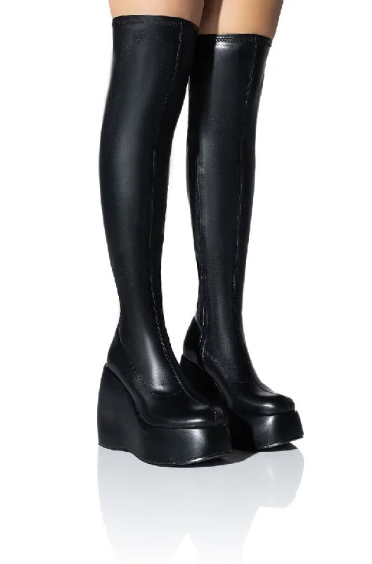 Knee high boots with a croc - embossed texture​DARCY BLACK WEDGE BOOT