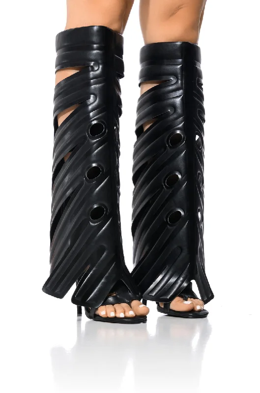 Knee high boots with padded insoles​LEAF PLANT DESIGN GLADIATOR SANDAL IN BLACK