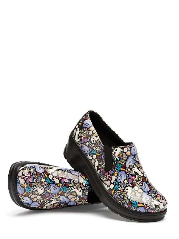 Women's Ankle Strap Mules in Navy Blue with Rhinestone Embellishments for a Sparkly LookWomen's Naples Clog In Wonderland Patent Women's Ankle Strap Mules in Navy Blue with Rhinestone Embellishments for a Sparkly LookWomen's Naples Clog In Wonderland Patent